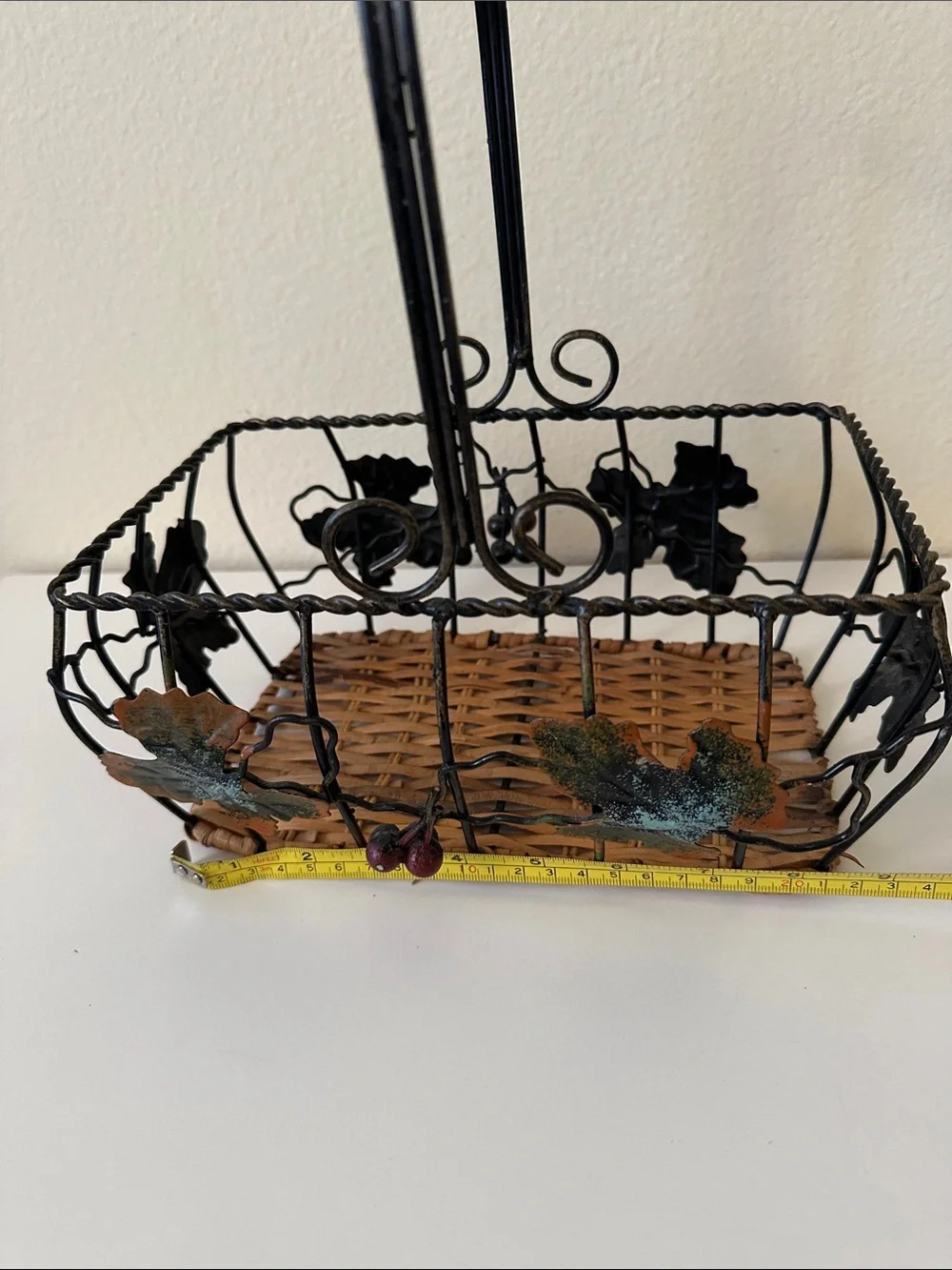 Black Metal and Brown Woven Decorative Basket with Green Leaf Accents